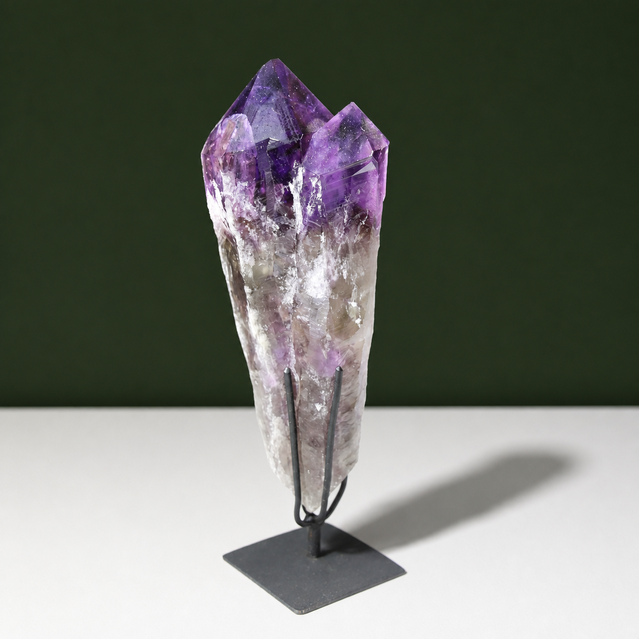 Multi-point naturally terminated amethyst wand on black metal stand