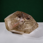 Polished rutilated quartz freeform, 417 g, angled view showing natural rutile inclusions.