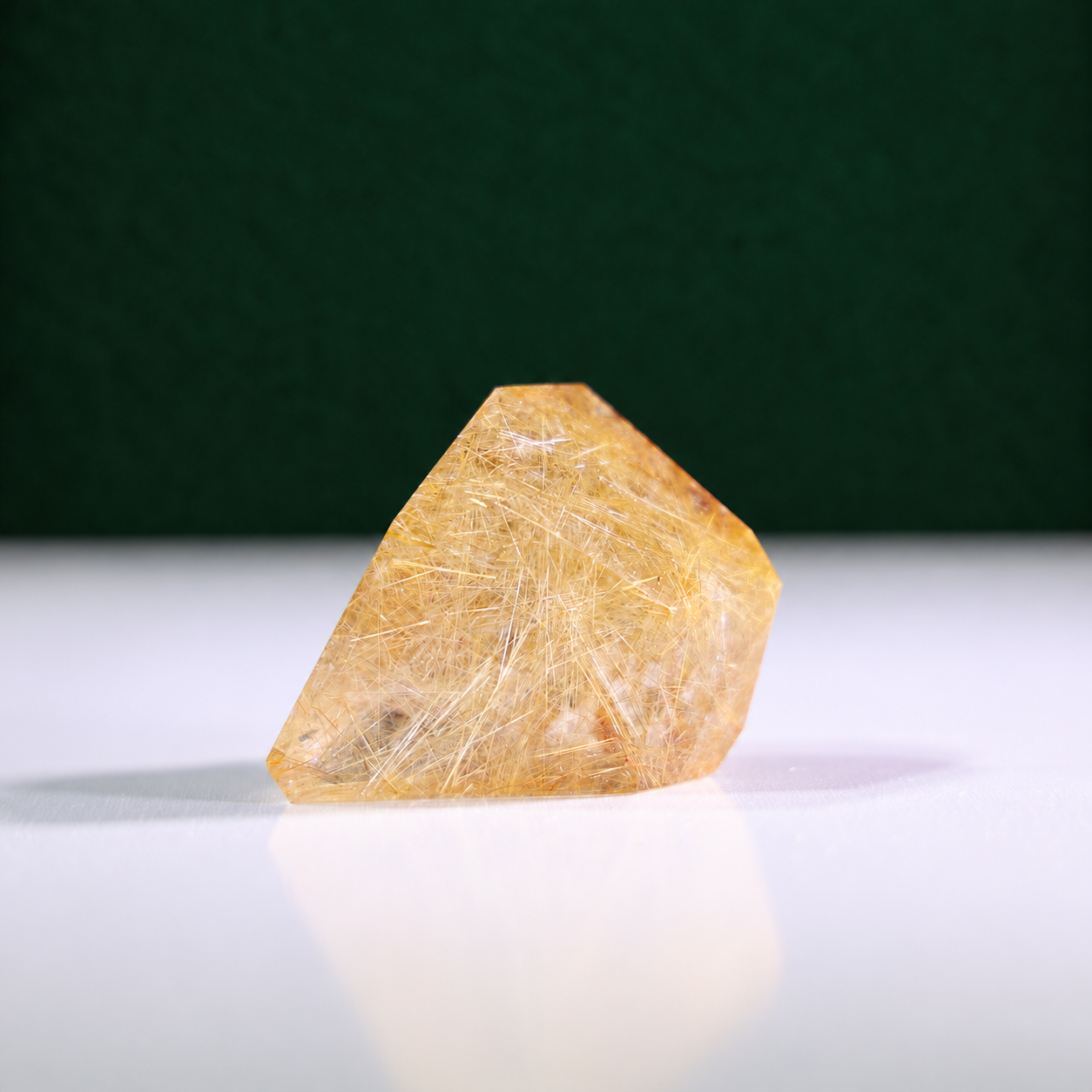 Polished rutilated quartz freeform, 75 g, alternate view 1 showing natural rutile inclusions.
