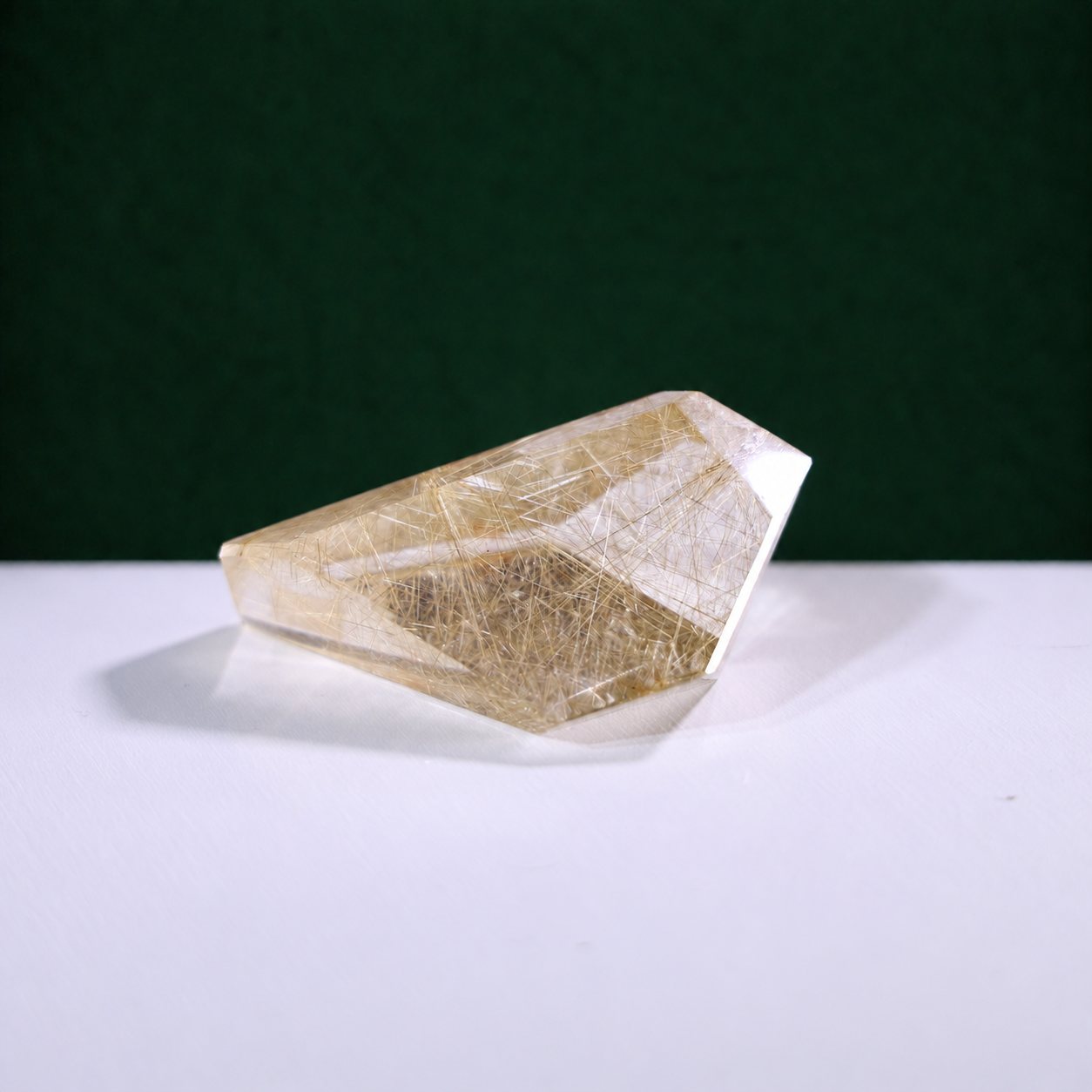 Polished rutilated quartz freeform, 79 g, alternate view 1 showing natural rutile inclusions.