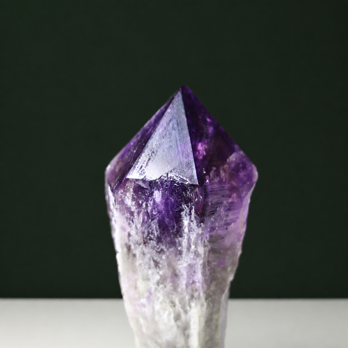 Deep violet amethyst wand, close view of natural facets