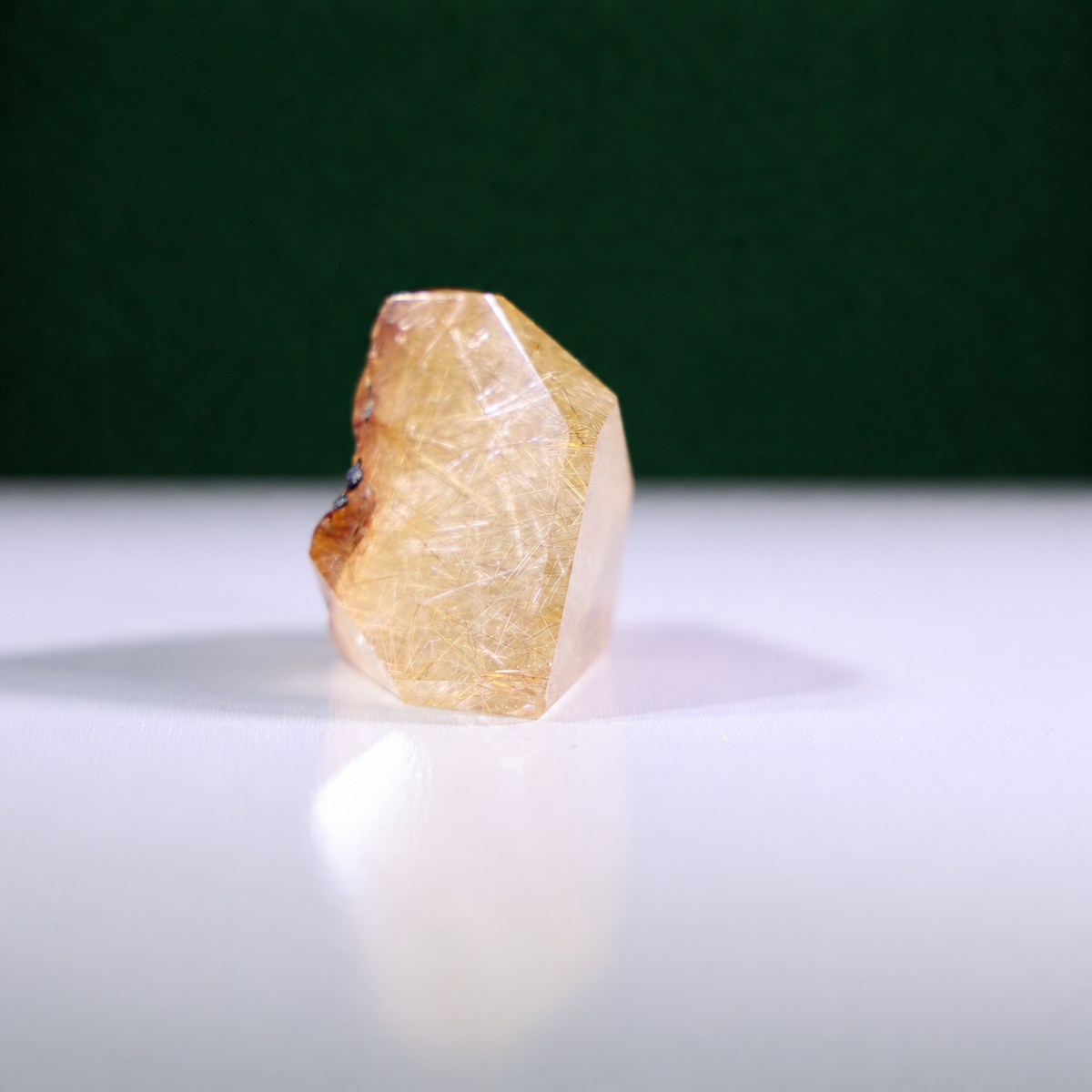Polished rutilated quartz freeform, 75 g, alternate view 2 showing natural rutile inclusions.