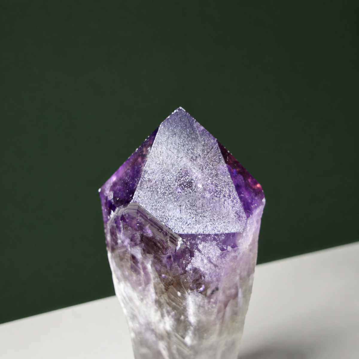Natural termination detail on sculptural amethyst wand