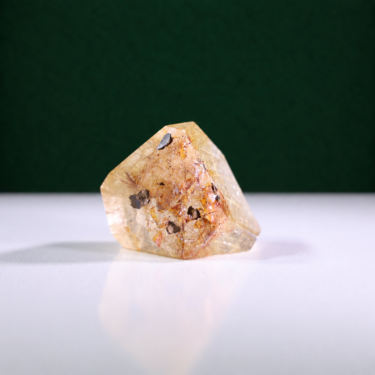 Polished rutilated quartz freeform, 75 g, alternate view 3 showing natural rutile inclusions.