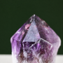 Growth markings detail on sculptural natural amethyst wand