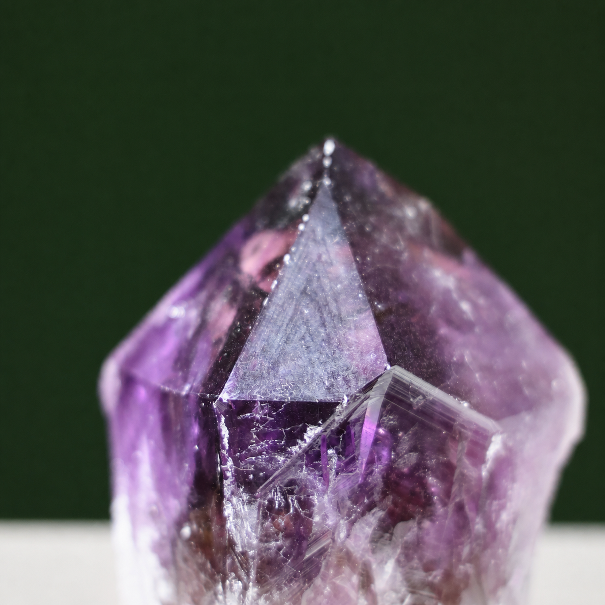 Growth markings detail on sculptural natural amethyst wand