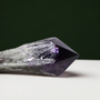Deep violet amethyst wand, horizontal crystal detail