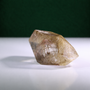 Polished rutilated quartz freeform, 417 g, detail angle showing natural rutile inclusions.
