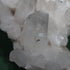 Reverse view of the curved Lemurian quartz cluster and included display base