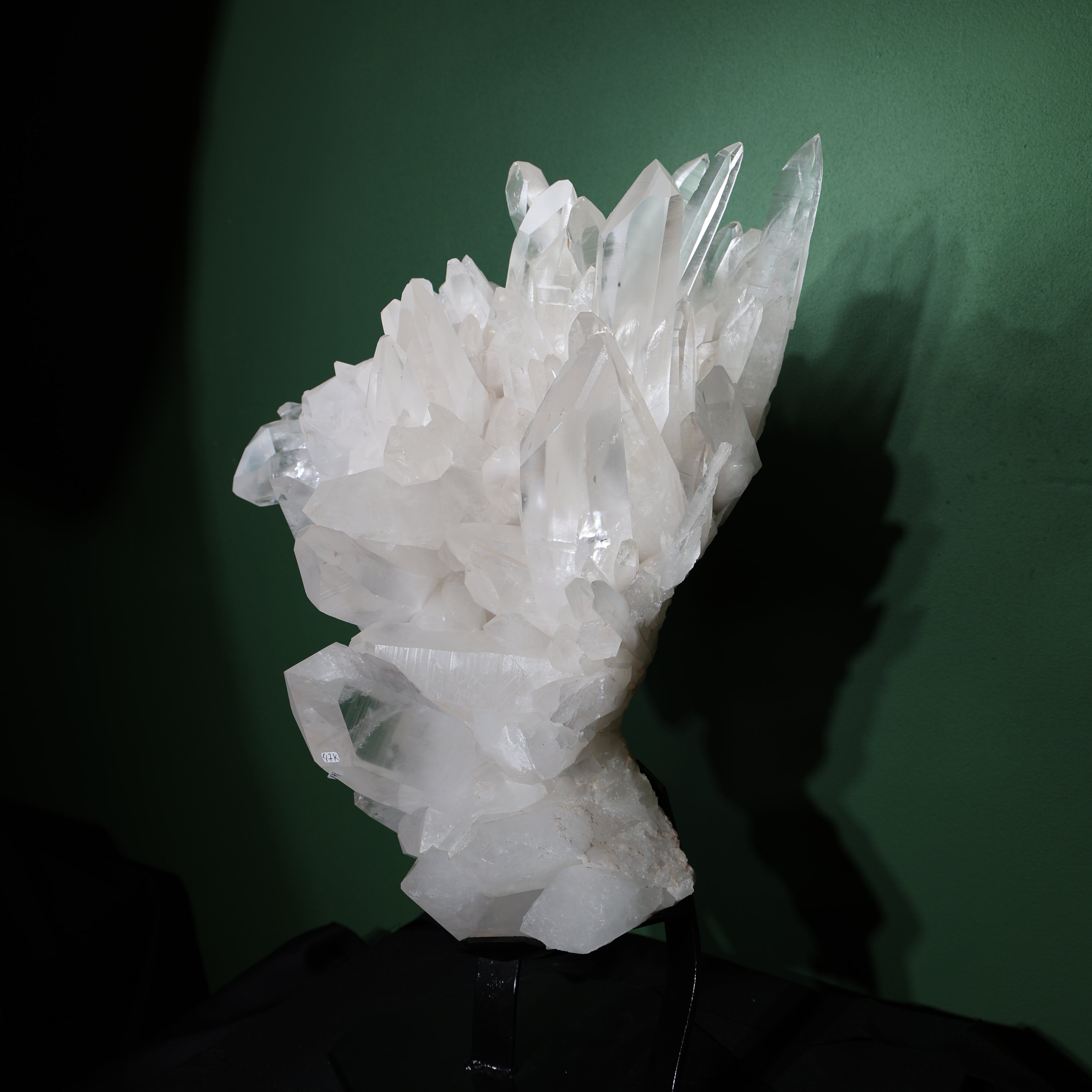 Side profile showing the unusual natural curve of the Lemurian quartz cluster
