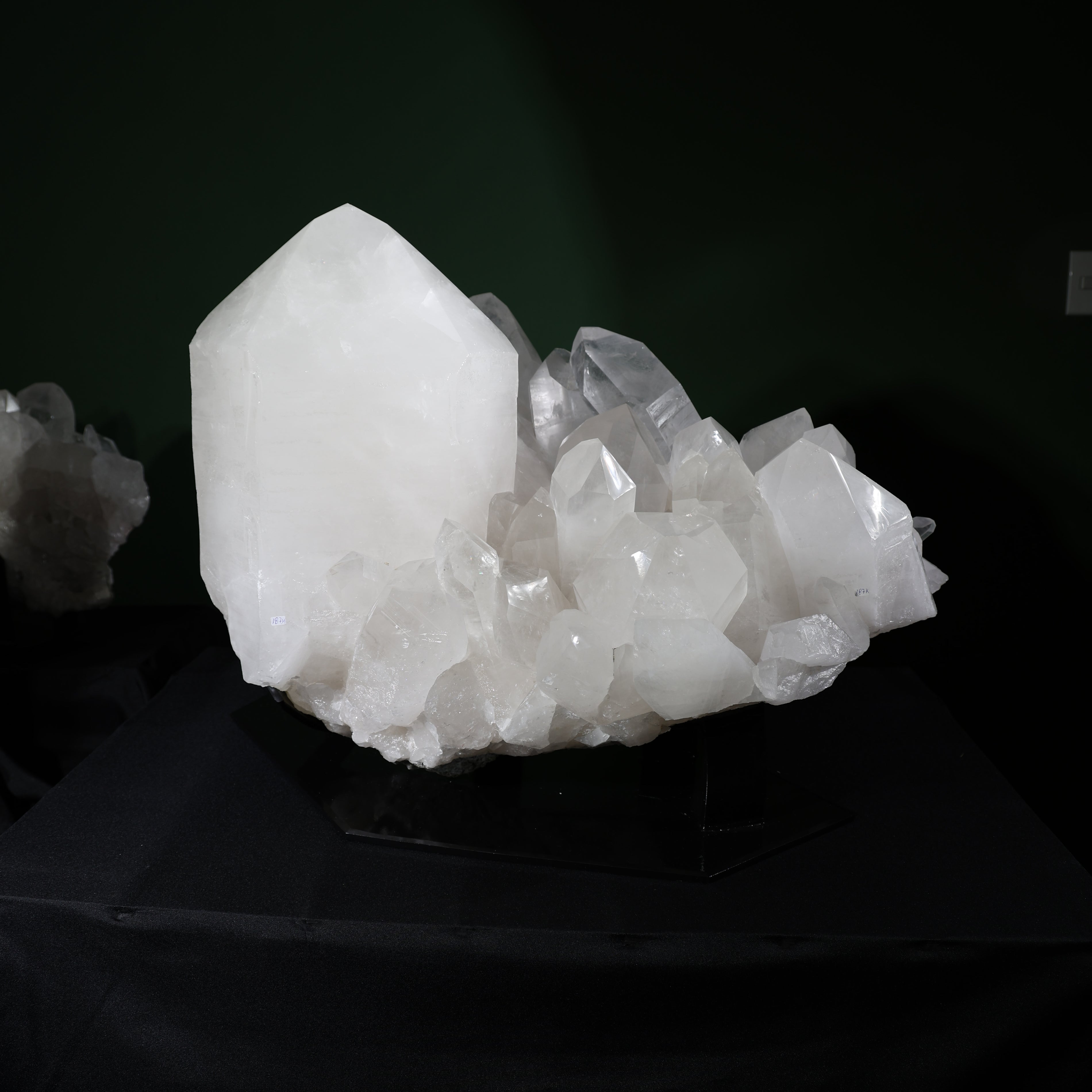 Front view of the dominant-point Lemurian quartz cluster on its included display base