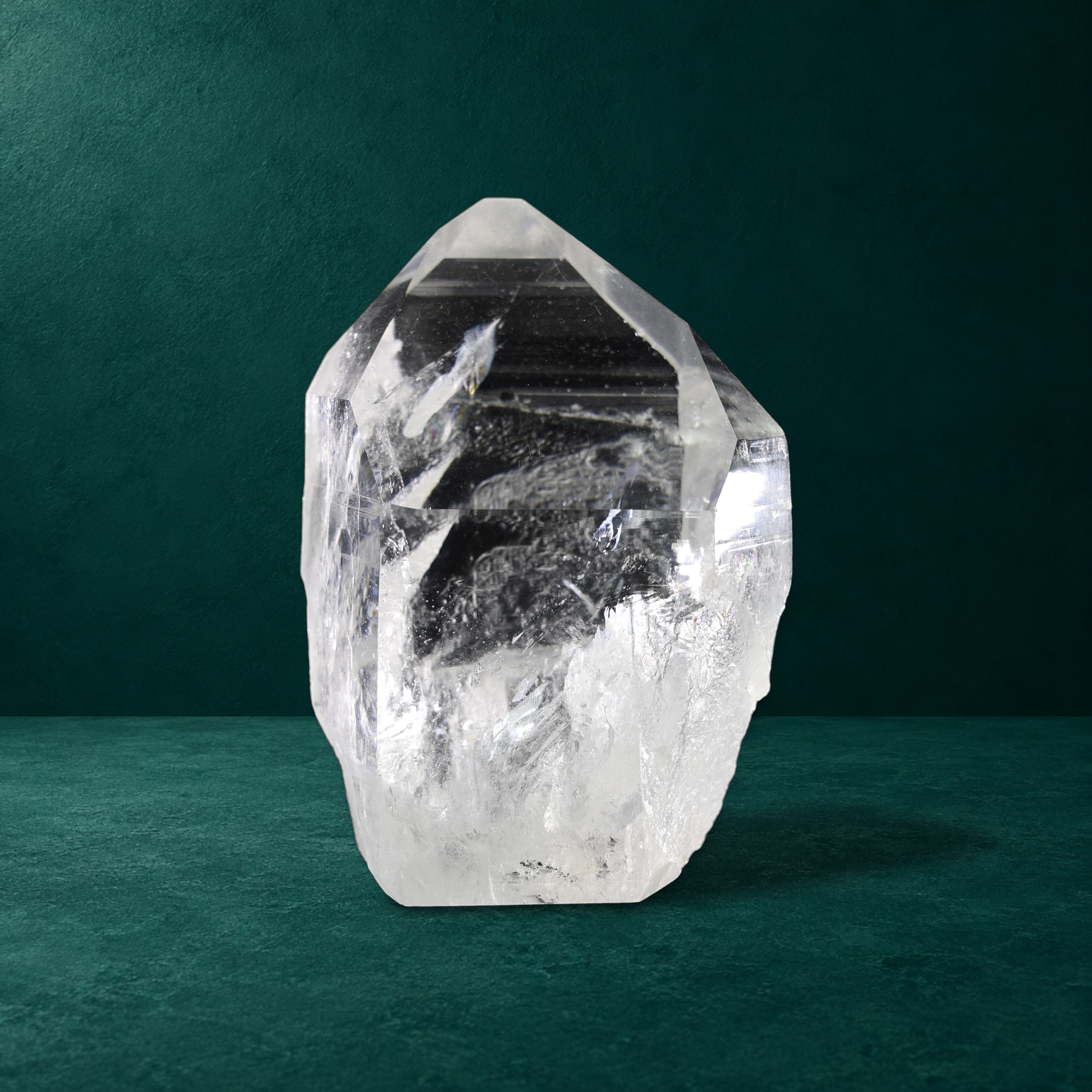 Polished quartz point with natural regrowth, 1.386 kg, front view.