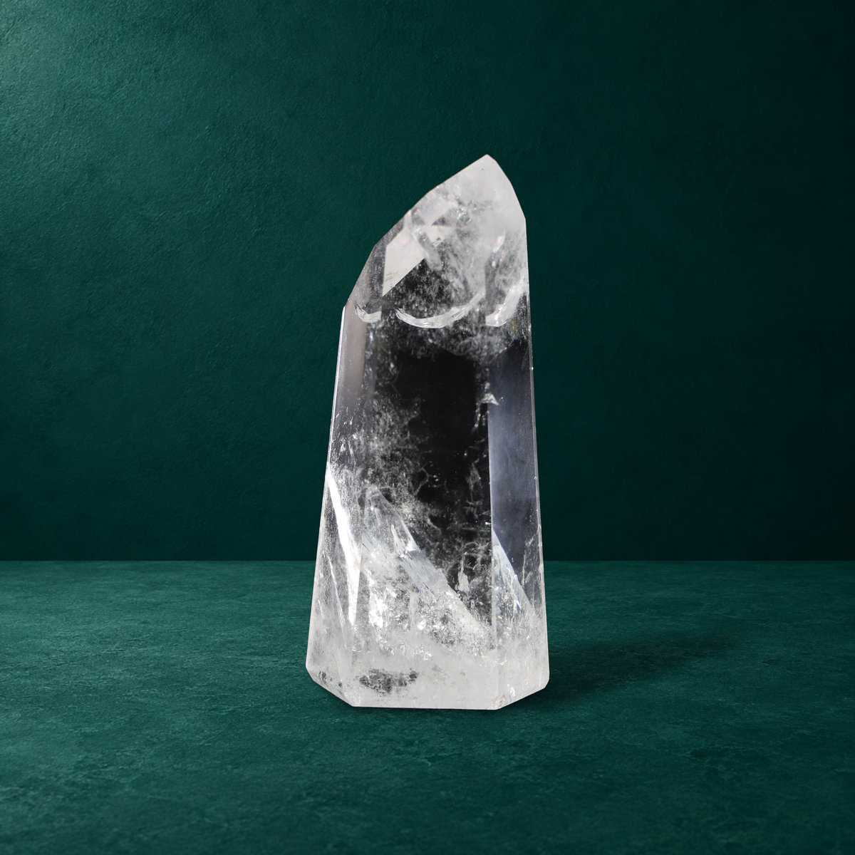 Polished quartz point, 0.799 kg, front view.