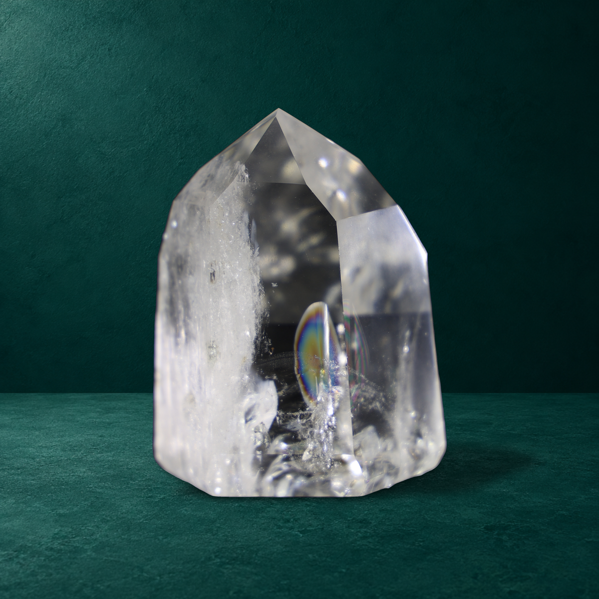 Another angle showing the rainbow within the polished quartz point.