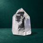 Polished quartz point, 0.748 kg, broad side view
