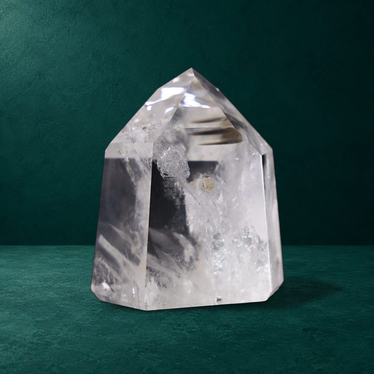 Polished quartz point, 0.748 kg, angled view