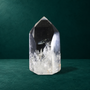 Polished quartz point, 0.790 kg, angled front view