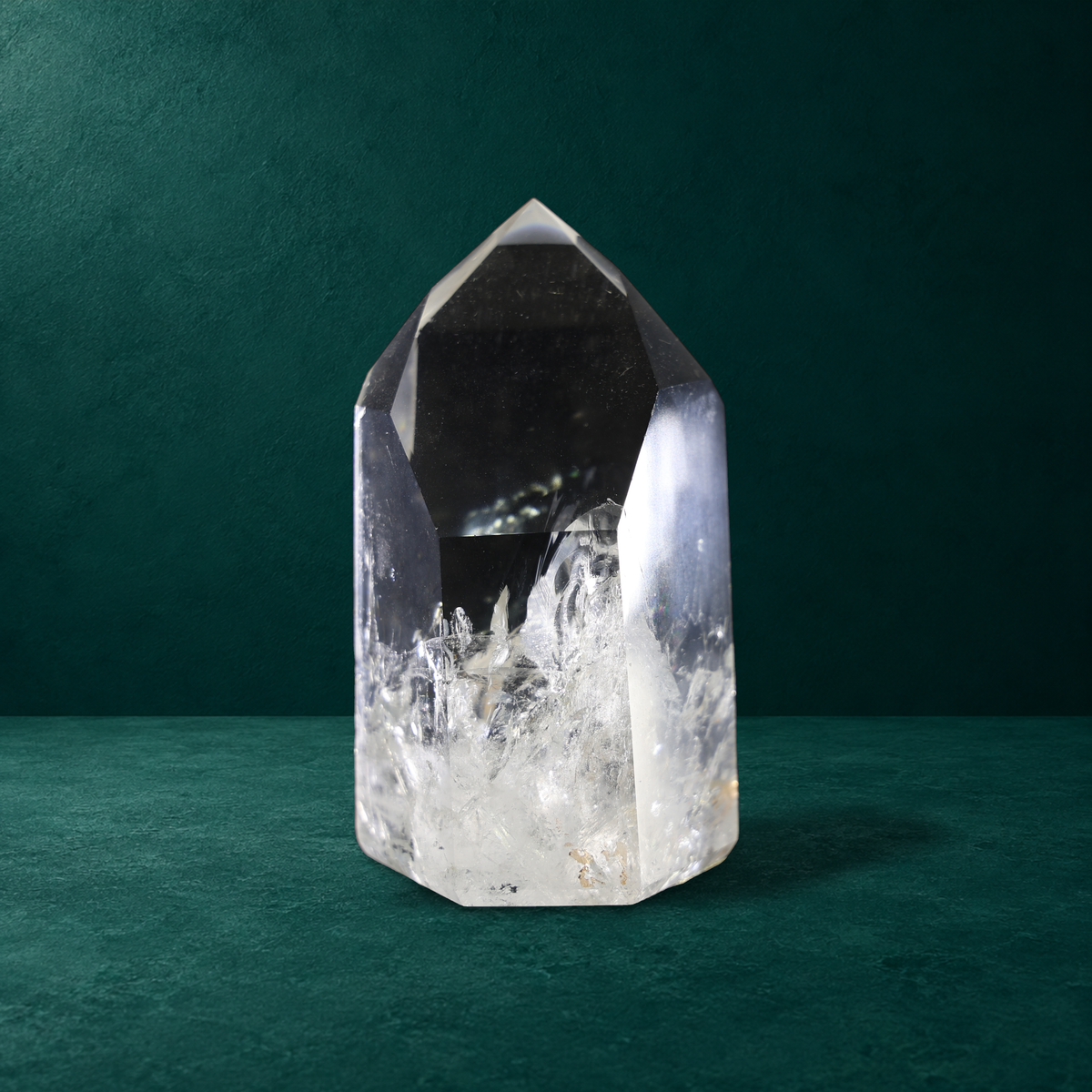 Polished quartz point, 0.790 kg, angled front view