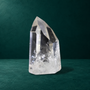 Polished quartz point, 0.790 kg, broad side view
