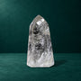 Polished quartz point showing its internal patterns and polished facets.