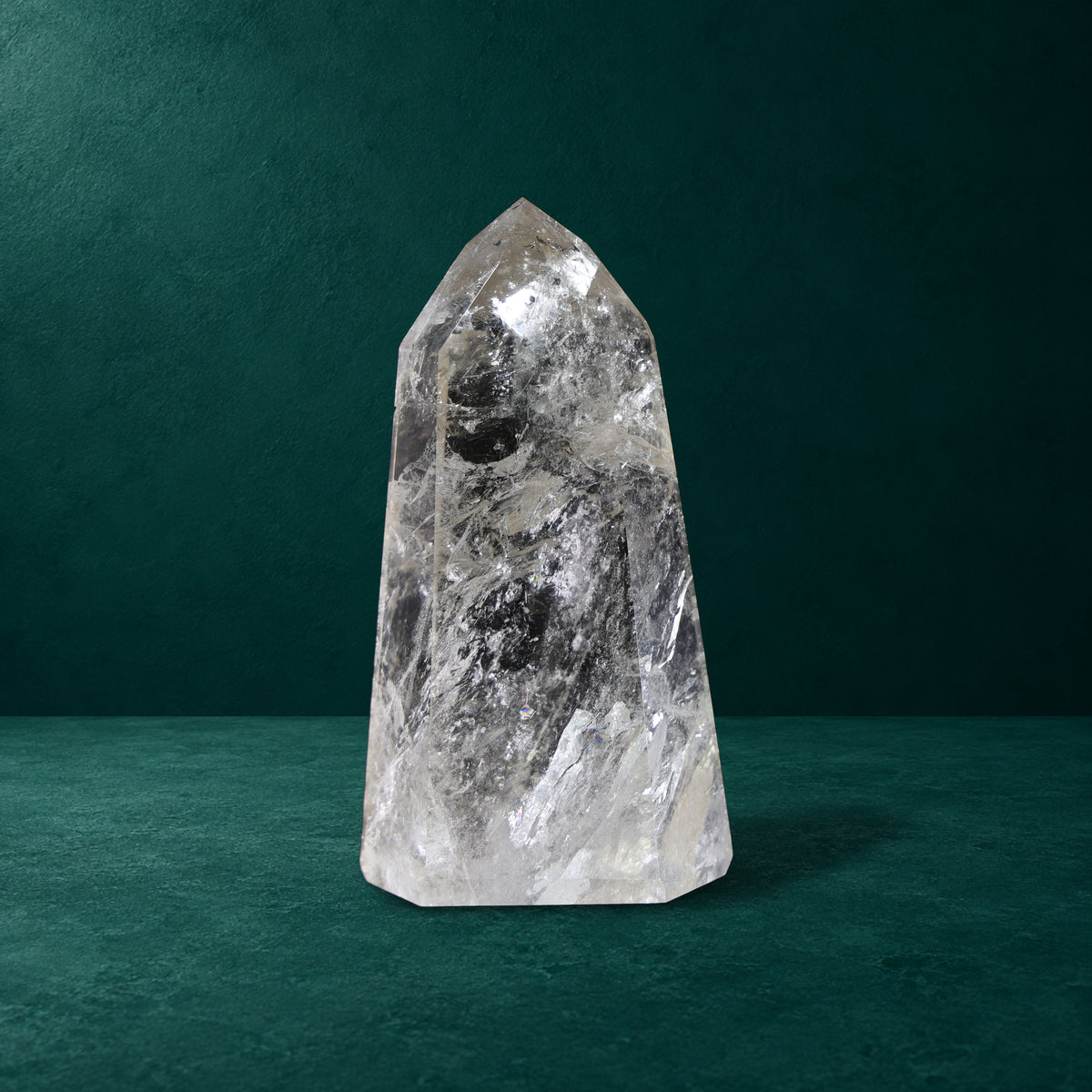 Polished quartz point showing its internal patterns and polished facets.