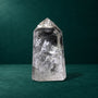 Polished quartz point, 1.049 kg, broad side view