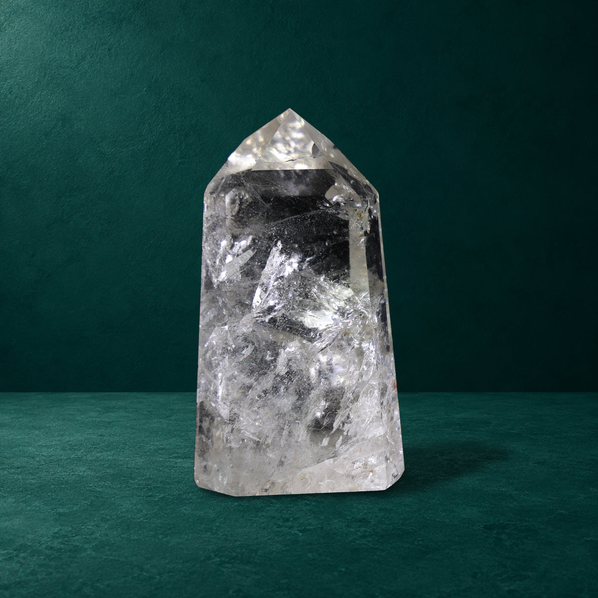 Polished quartz point, 1.049 kg, broad side view