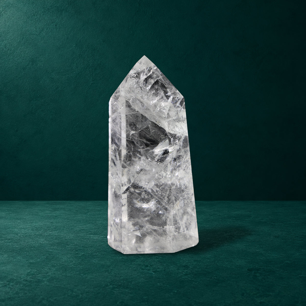 Polished quartz point, 0.897 kg, front view.
