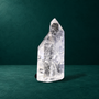 Narrow side view of the 0.718 kg polished quartz point.