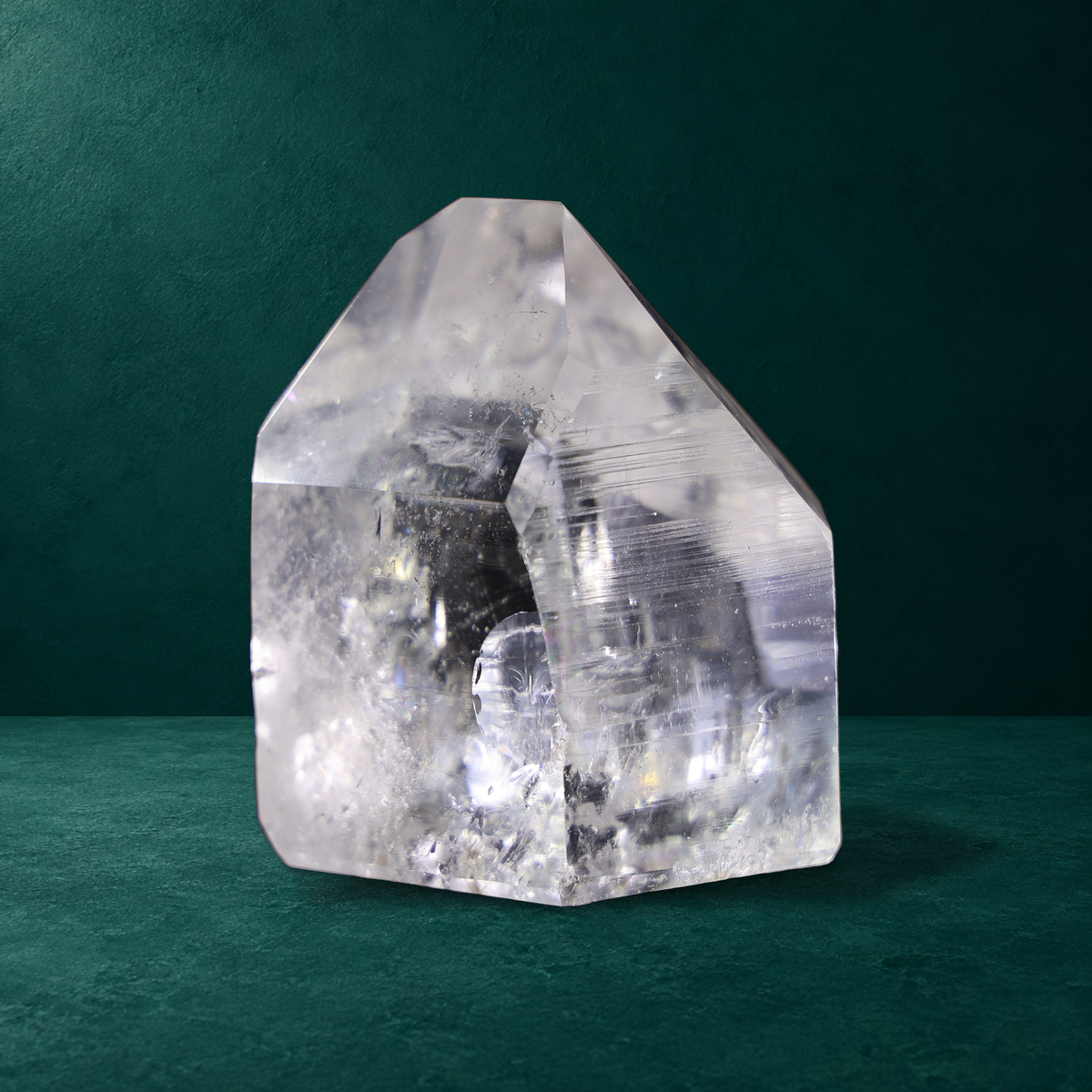 Polished quartz point, 0.760 kg, reverse view with striations