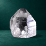 Polished quartz point, 0.760 kg, side face with preserved striations