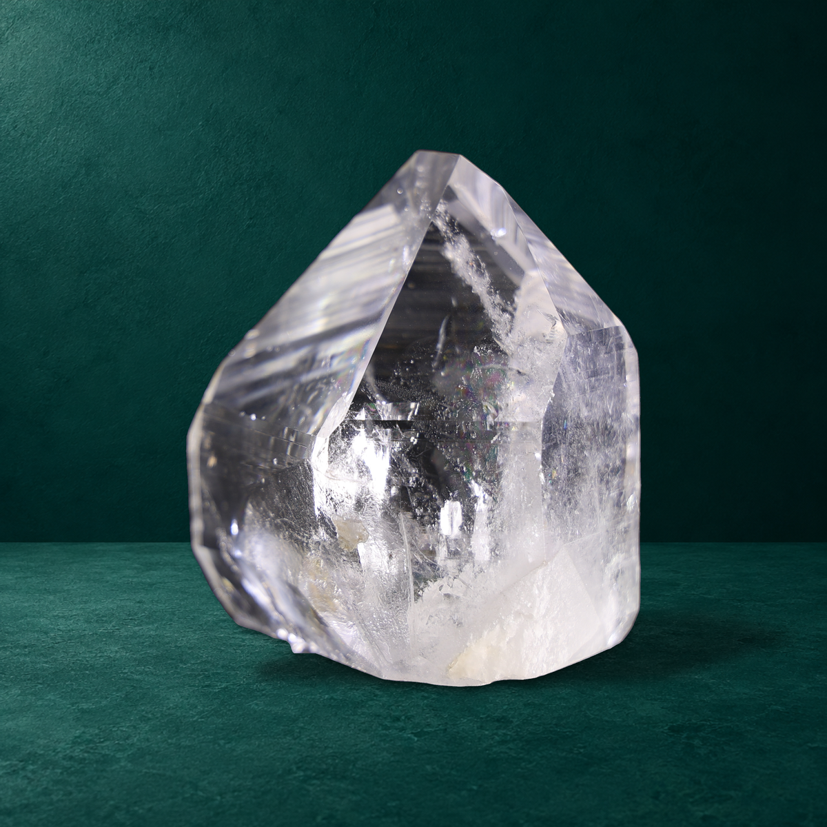 Polished quartz point, 0.760 kg, opposite angled view