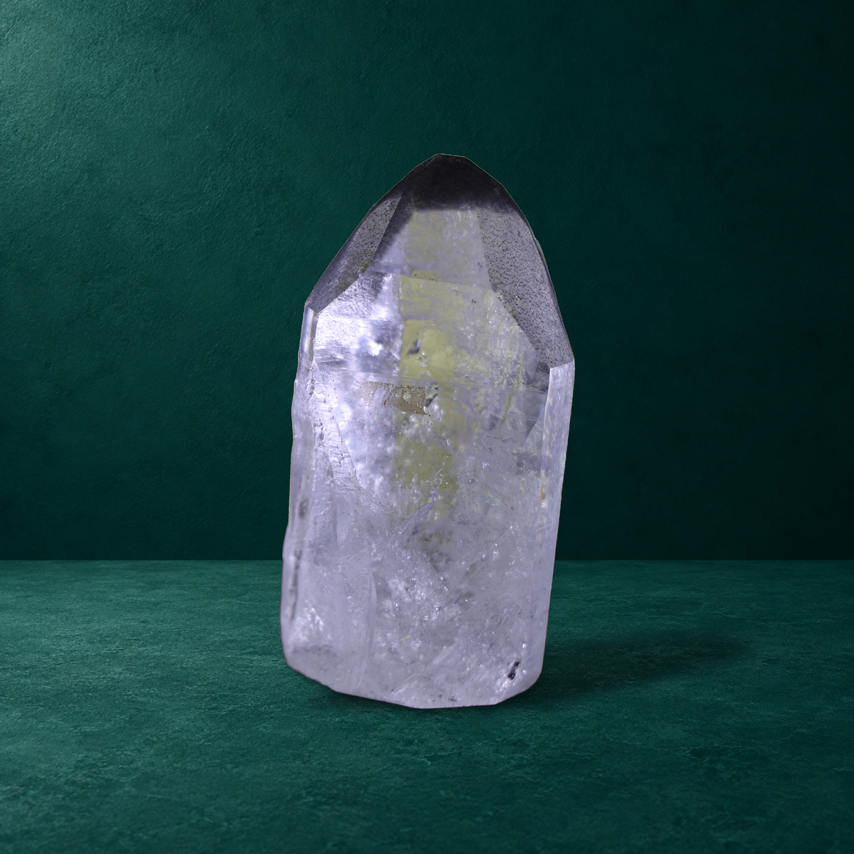 Individual polished quartz point from the three-piece set, side view