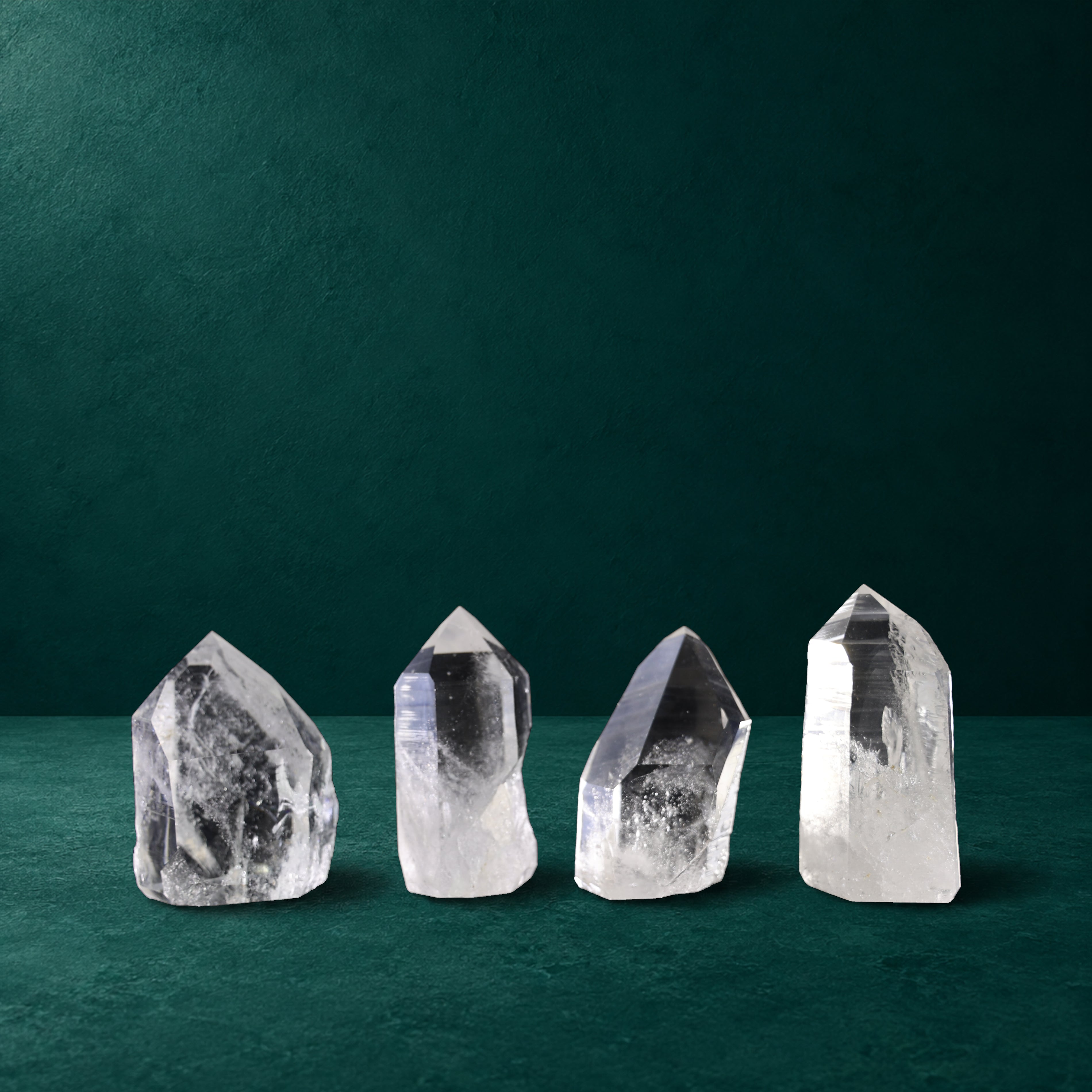Set of four polished quartz points, 1.269 kg total, group view