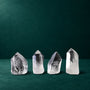 Set of four polished quartz points, 1.269 kg total, group view
