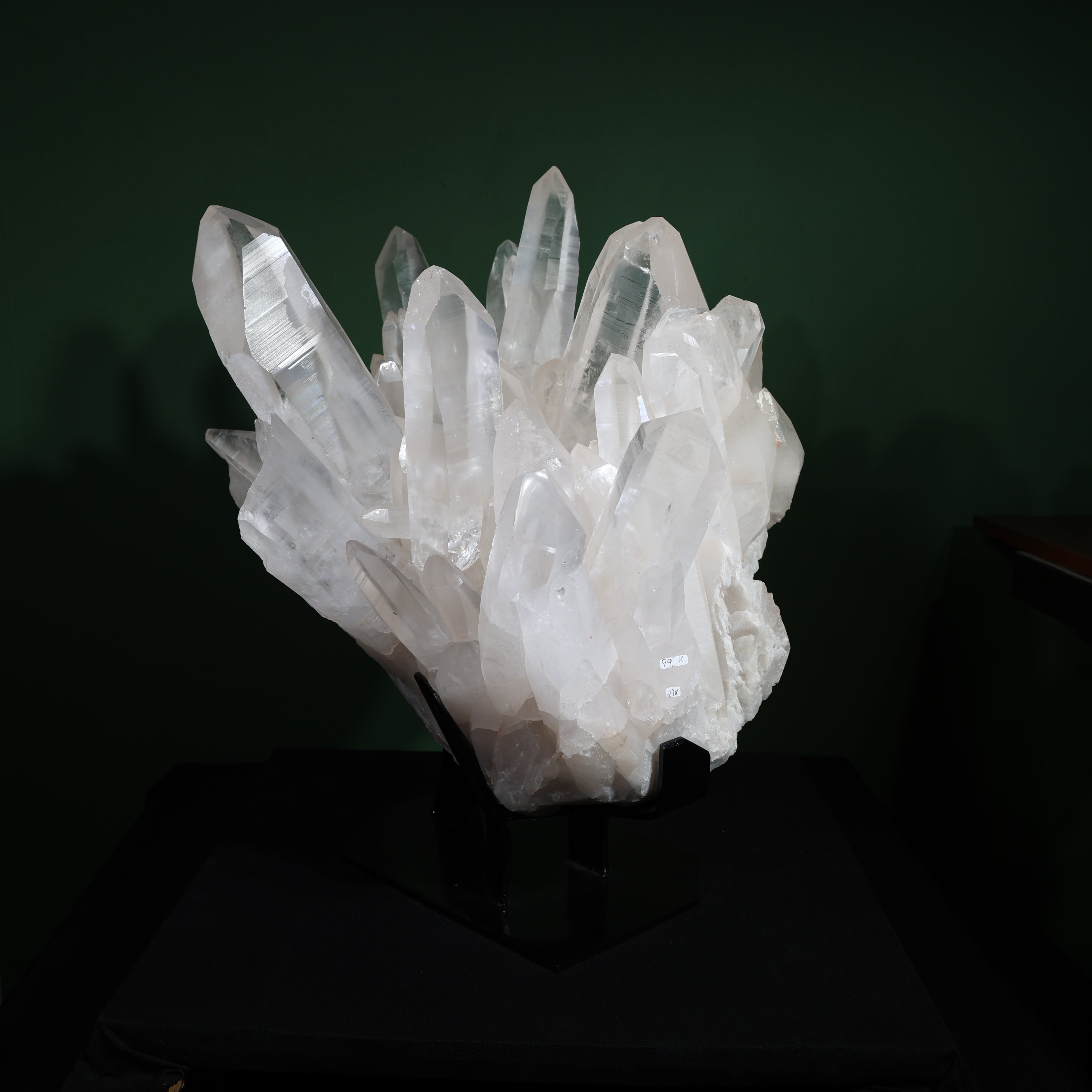 Front view of the large-point Lemurian quartz cluster on its included display base