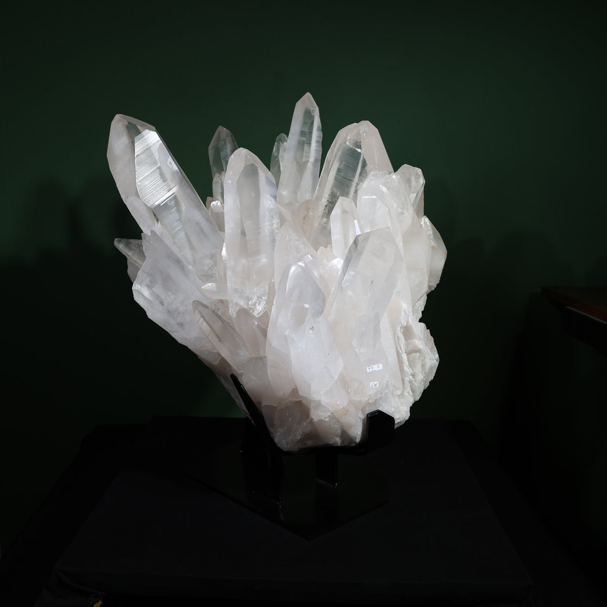 Front view of the large-point Lemurian quartz cluster on its included display base